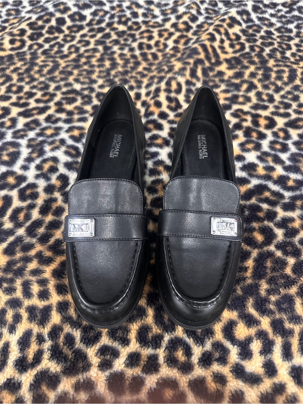 Michael Kors Black Leather Slip-On Loafers with Silver Logo Plaque